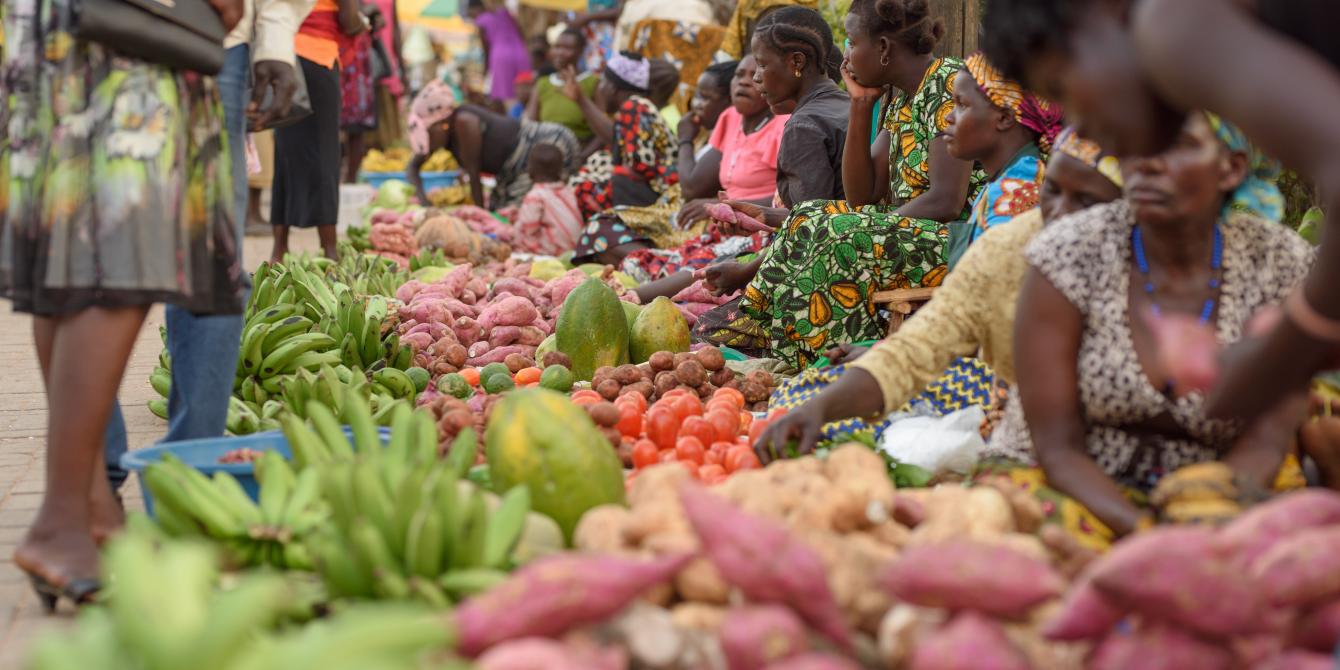 Women selling produce in the market place.